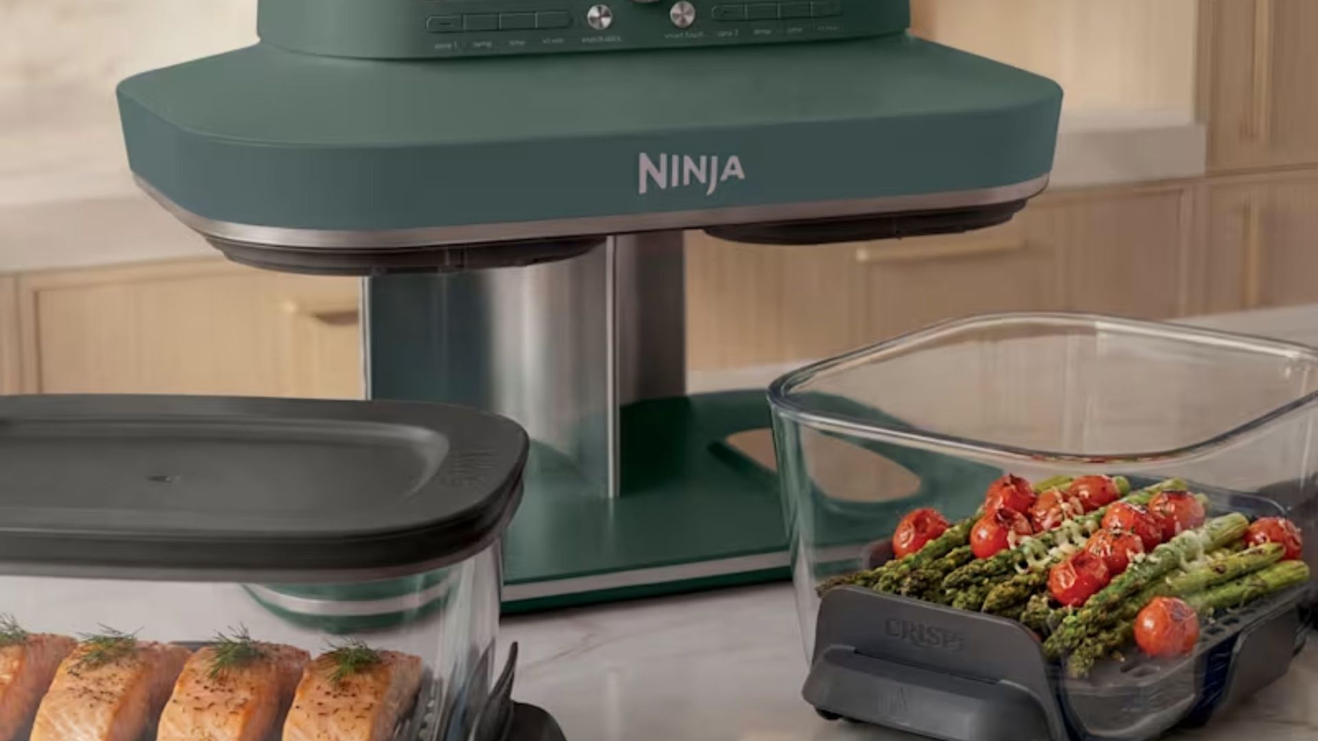A Green ninja crispi dualzone air fryer with the two glass dishes pulled out.