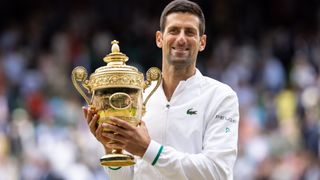 Novak Djokovic of Serbia with the trophy after victory in the Men's Singles Final