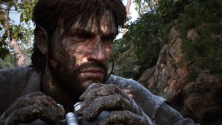 A close-up of Naked Snake's camouflaged face.