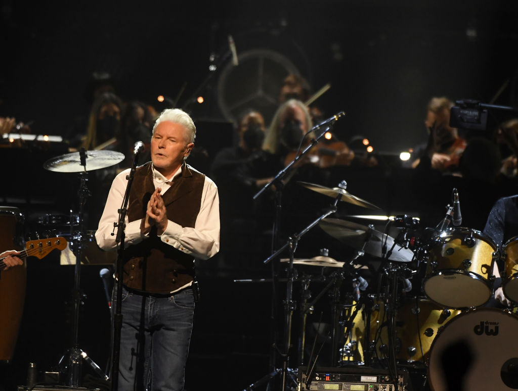 Don Henley lead singer of The Eagles singing into a microphone