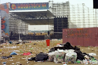 A deserted Woodstock stage covered in rubbish