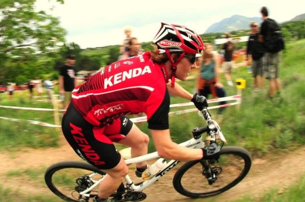 Kathy Sherwin (Kenda Titus) rides in sixth place.