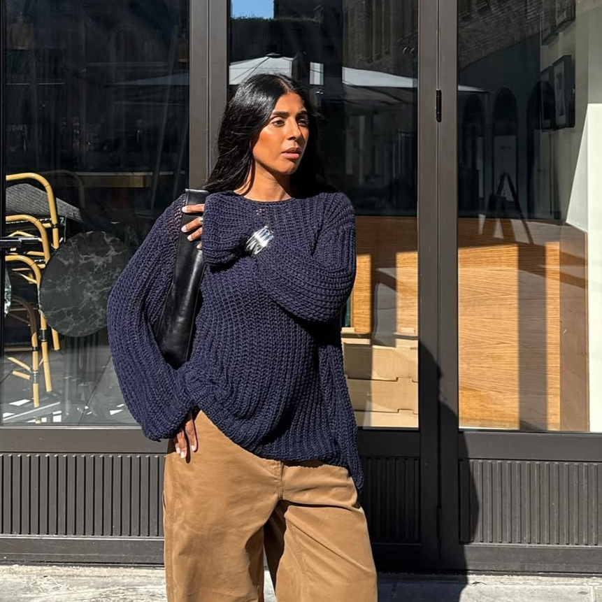 @monikh wearing navy jumper