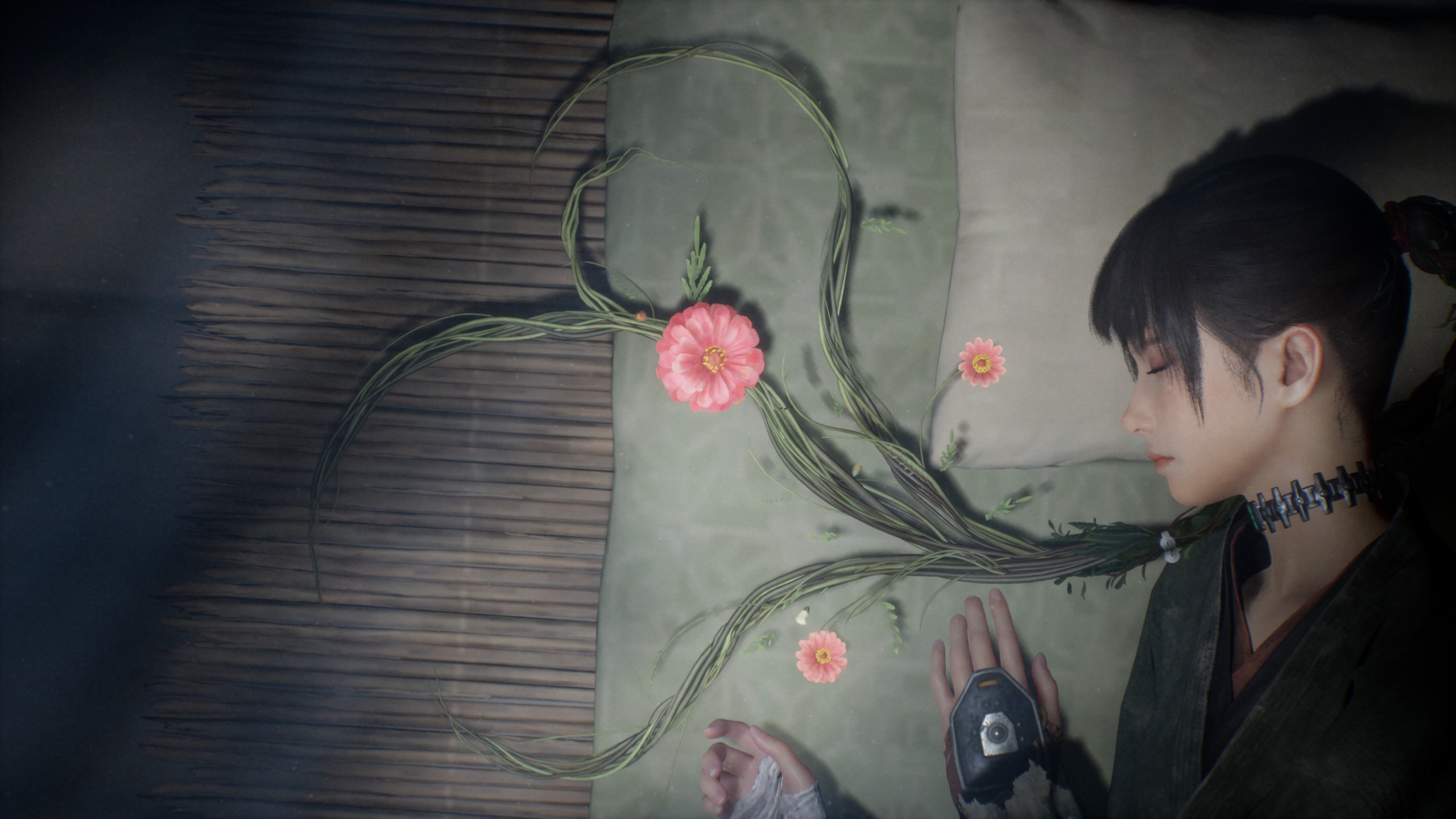 A woman lies next to some flowers
