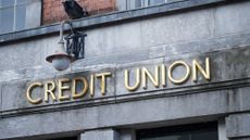 Credit union sign on stone wall