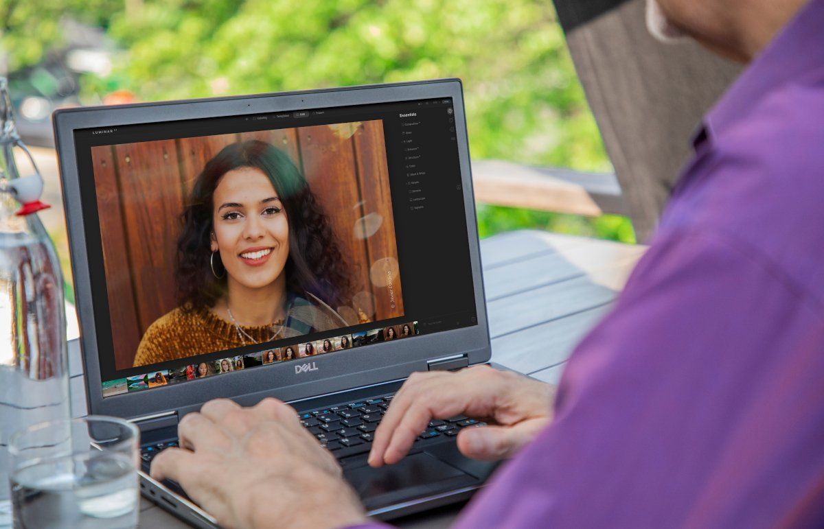 Man using LuminarAI on Laptop