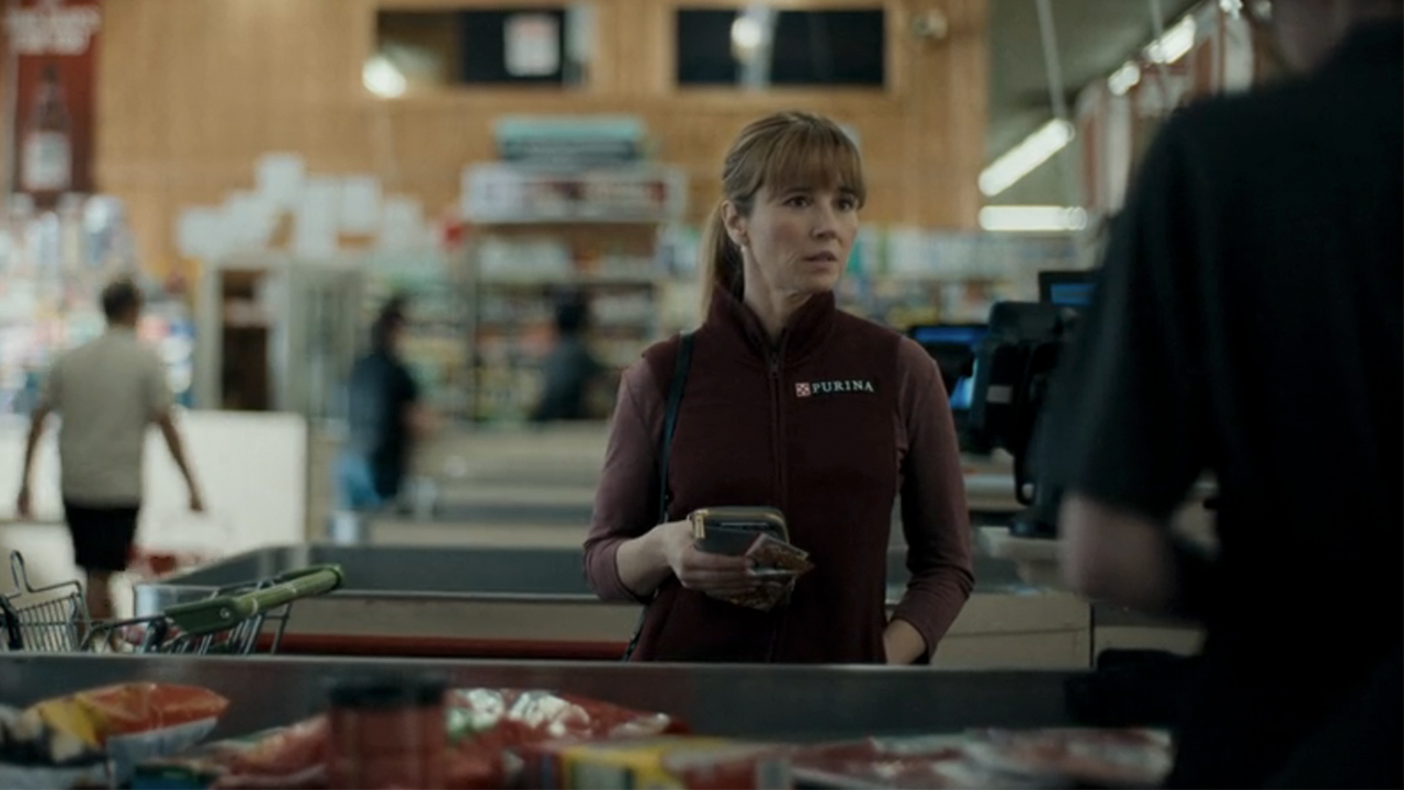 Linda Cardellini at a checkout counter at a local grocery store in DTF St. Louis.