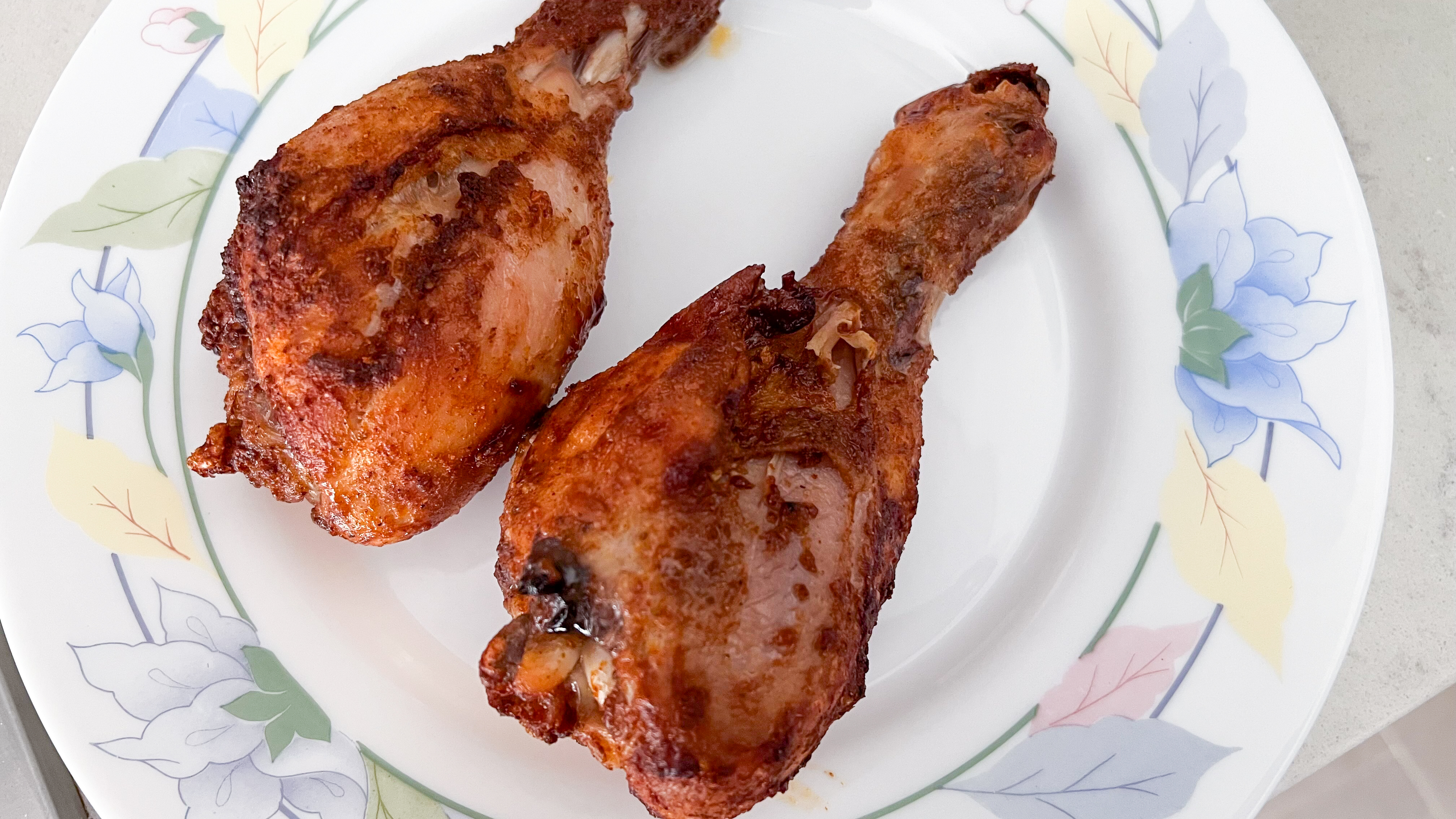 Chicken drumsticks cooked in the Philips 5000 Series Dual Basket Air Fryer XXL Steam