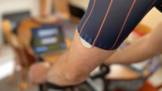 Male cyclist wearing a Supersapiens glucose monitor