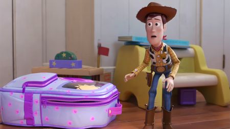 Woody getting called out by his fellow toys while standing next to a backpack in Toy Story 4.