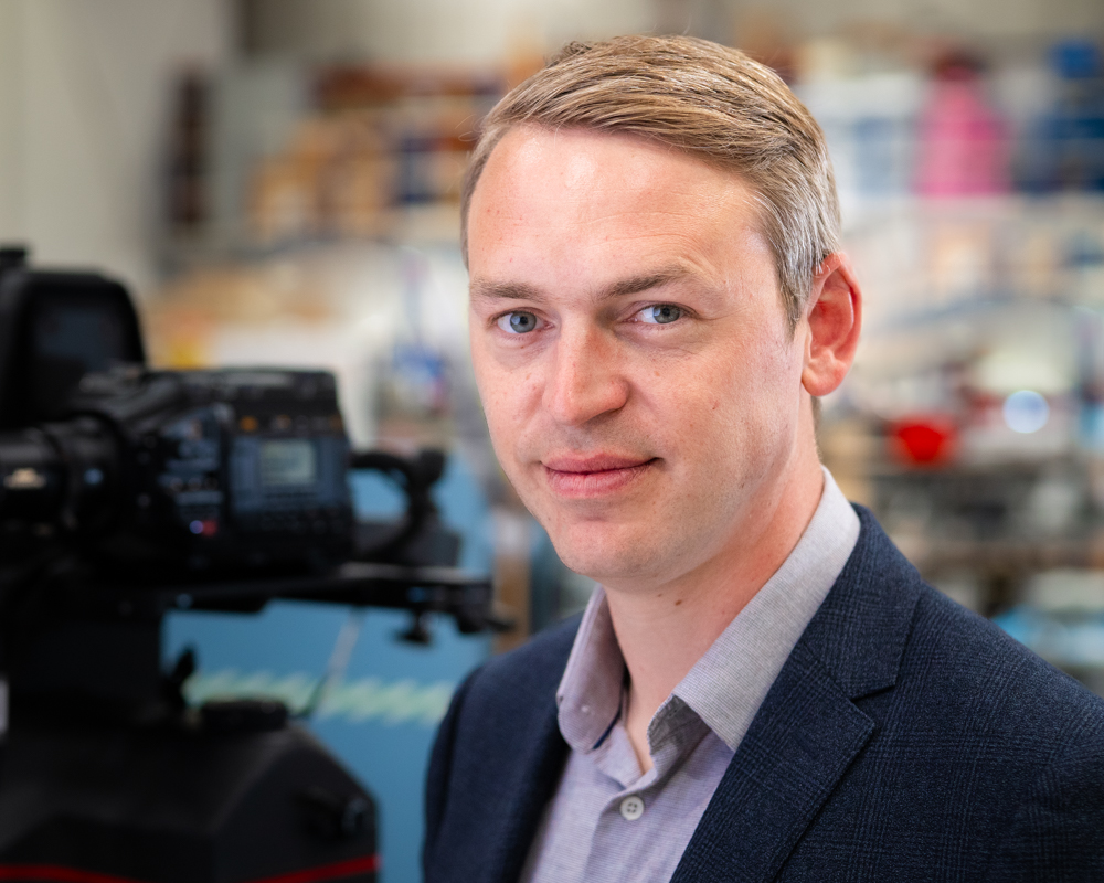Headshot of Max Holland.