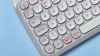 The Logitech POP Icon Keys keyboard against a blue background.