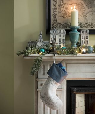 Christmas stockings over fireplace designed by Shea McGee