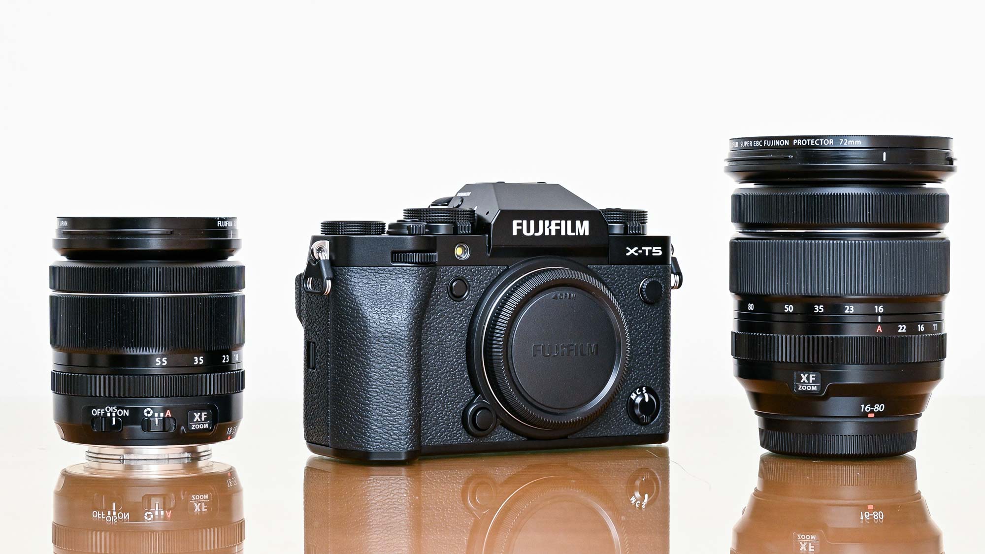 Fujifilm X-T5 on table with lenses
