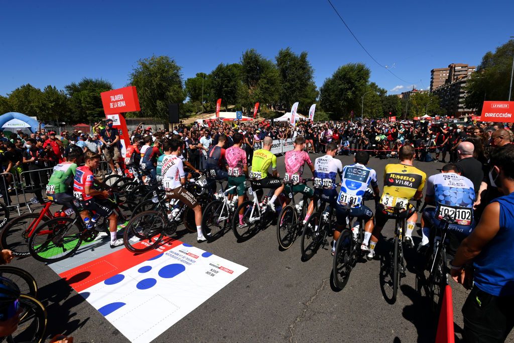 TALAVERA DE LA REINA SPAIN SEPTEMBER 09 Patrick Bevin of New Zealand and Team Israel Premier Tech Remco Evenepoel of Belgium and Team QuickStep Alpha Vinyl Red Leader Jersey Mads Pedersen of Denmark and Team Trek Segafredo Green Points Jersey Rohan Dennis of Australia and Team Jumbo Visma Richard Carapaz of Ecuador and Team INEOS Grenadiers Polka Dot Mountain Jersey Christopher Froome of United Kingdom and Team Israel Premier Tech and Hugh Carthy of United Kingdom and Team EF Education Easypost Daniel Mclay of United Kingdom and Team Arka Samsic James Callum Shaw of United Kingdom and Team EF Education Easypost Ben Turner of United Kingdom Luke Plapp of Australia and Tao Geoghegan Hart of United Kingdom Dylan Van Baarle of Netherlands Carlos Rodriguez Cano of Spain and Team INEOS Grenadiers observed a minute of silence in memory of Queen Elizabeth II prior to the 77th Tour of Spain 2022 Stage 19 a 1383km stage from Talavera de la Reina to Talavera de la Reina LaVuelta22 WorldTour on September 09 2022 in Talavera de la Reina Spain Photo by Tim de WaeleGetty Images