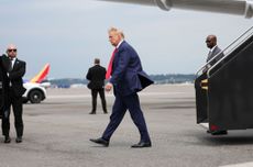 Donald Trump outside airplane