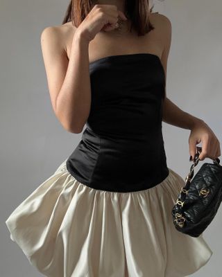 @deborabrosa wearing a black and white bubble hem dress from Marlies Grace.