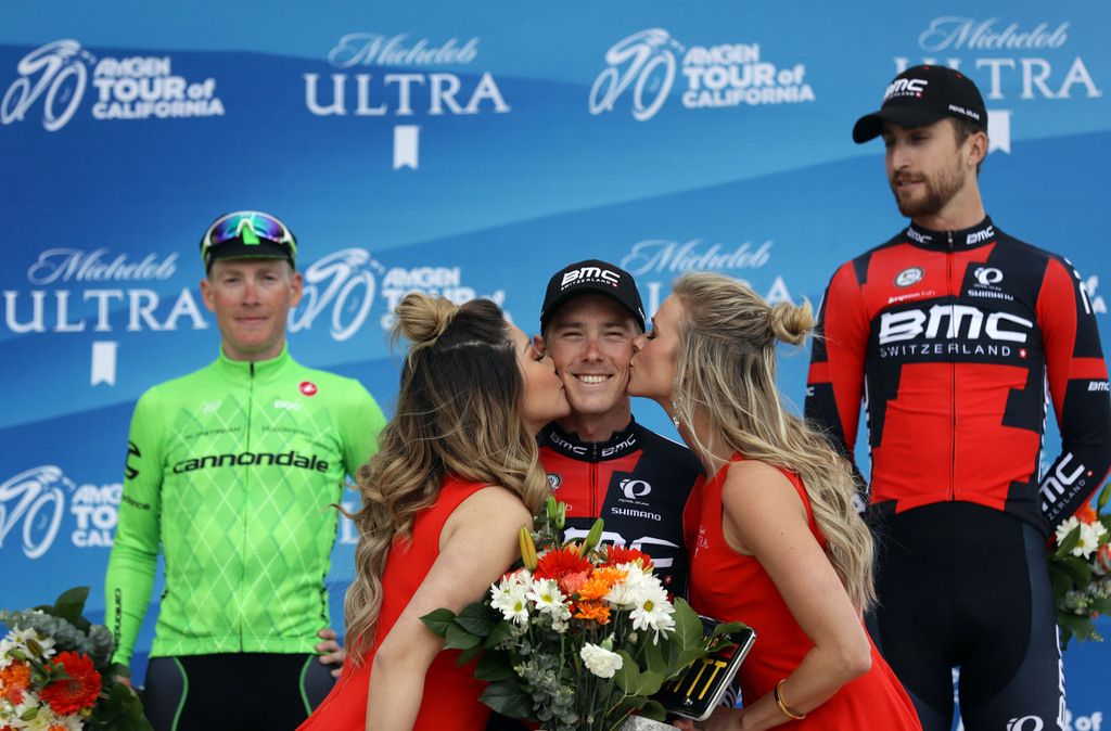 Stage winner Rohan Dennis receiving kisses on the podium