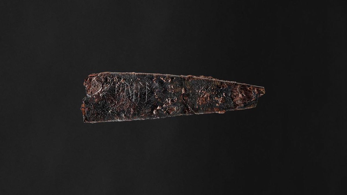 Side view of the blade of an 1800 year-old iron knife with Danish runes that seem to spell out the word &quot;hirila.&quot;