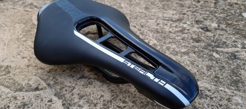 A close up of the Pro Stealth Carbon saddle on a stone floor