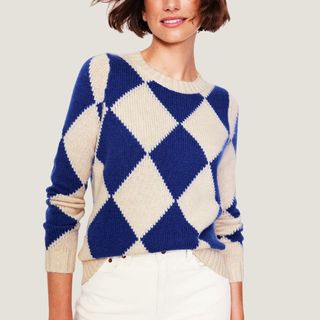 flat lay image of a woman wearing a checked blue and white jumper