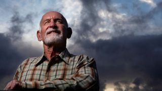 Royal Robbins in front of a cloudy sky