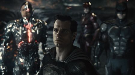 Superman with Cyborg, Flash, and Batman in the background in Zack Snyder's Justice League.