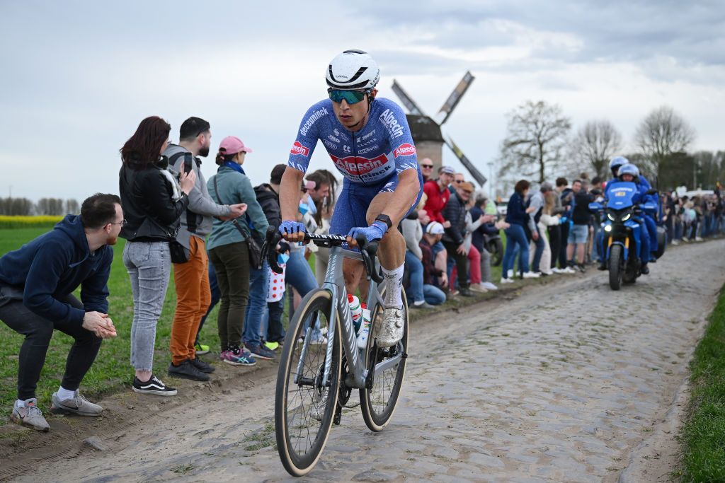 ROUBAIX FRANCE APRIL 07 Jasper Philipsen of Belgium and Team Alpecin Deceuninck competes in the chase group passing through the Templeuve MoulindeVertain cobblestones sector while fans cheer during the 121st ParisRoubaix 2024 a 2597km one day race from Compiegne to Roubaix UCIWT on April 07 2024 in Roubaix France Photo by Dario BelingheriGetty Images
