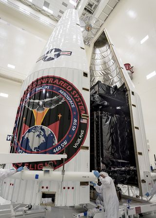 The Air Force's Space Based Infrared System (SBIRS) Flight 3 satellite is encapsulated in its fairing.