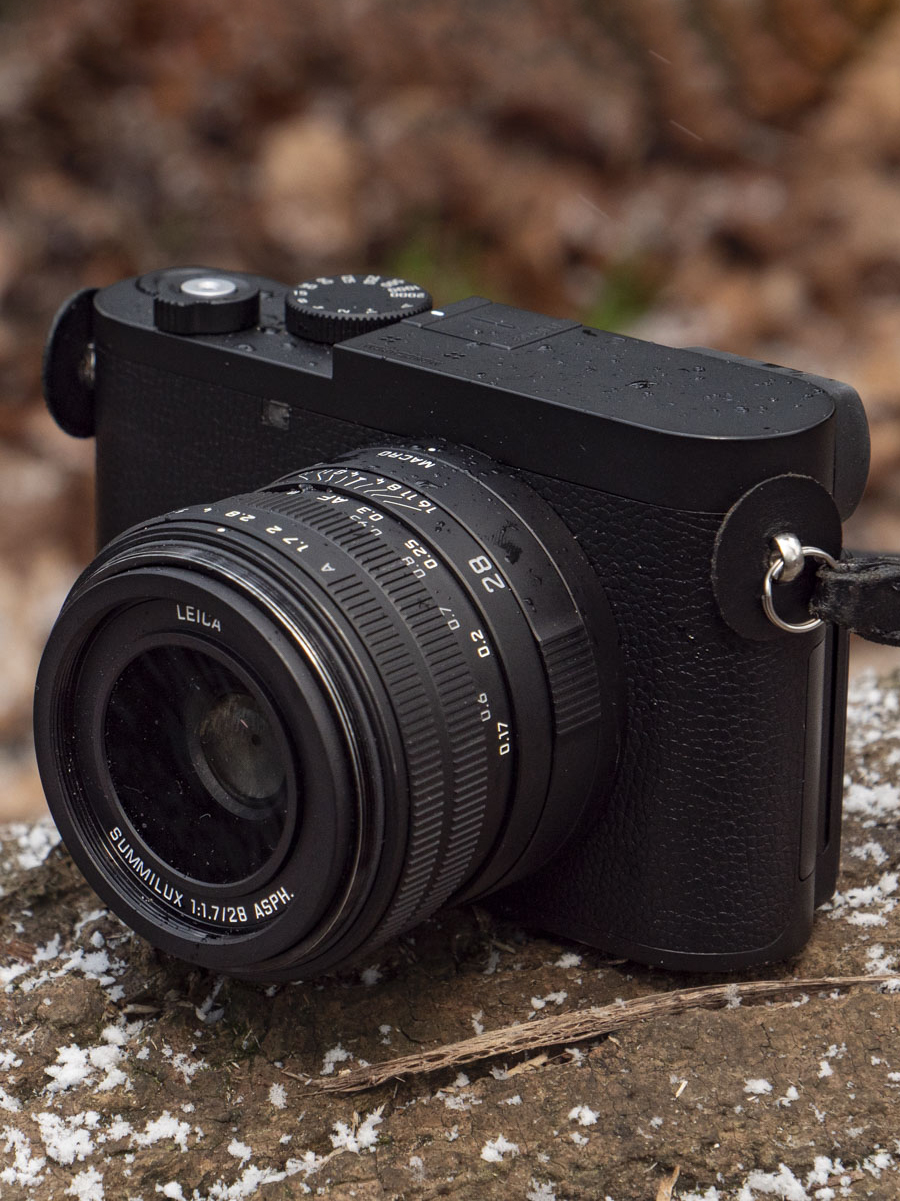 Q3 Monochrom camera on a snowy log