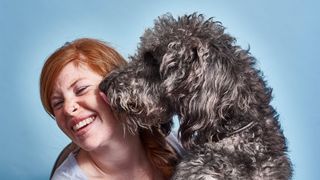 Dog licking woman
