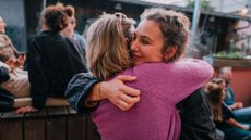 Two women hugging