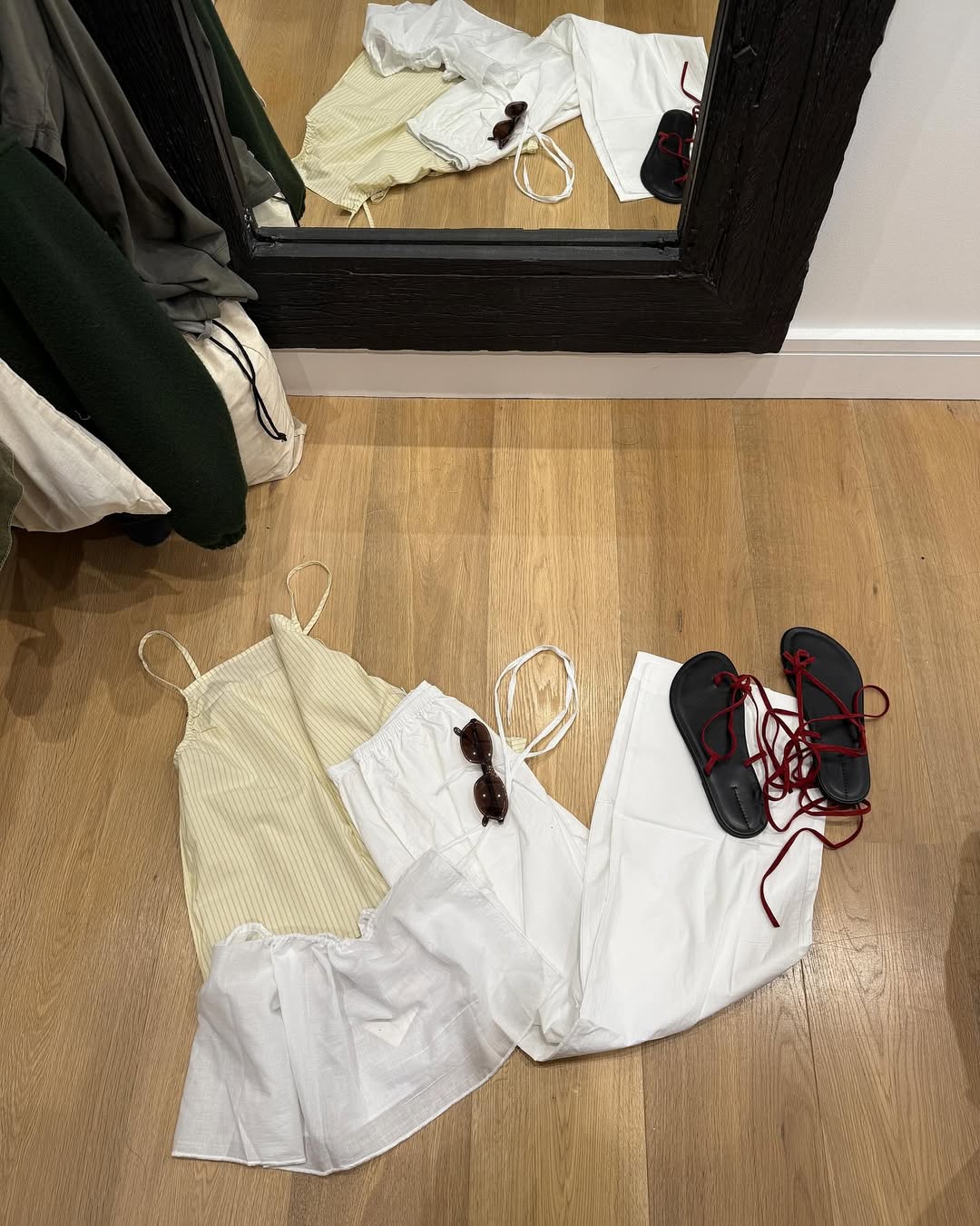 Summer outfit on the ground of a closet