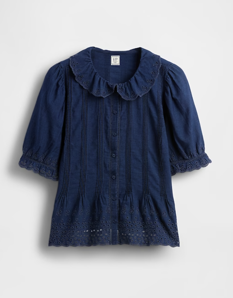 a denim gap doen shirt in front of a plain backdrop
