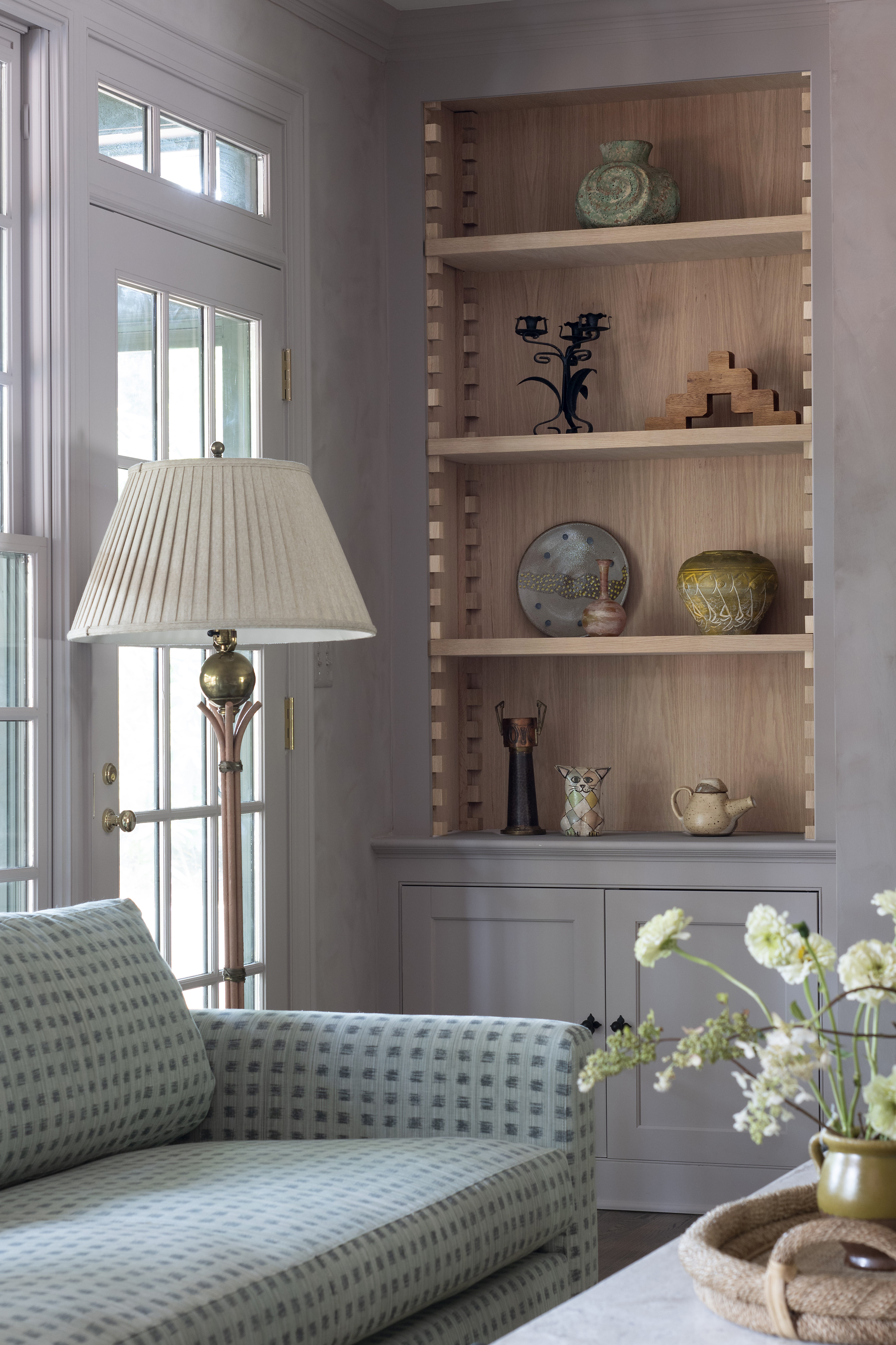 a living room with adjustable shelving using the cabinet step design