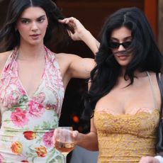 Kendall Jenner and Kylie Jenner arrive in summery styles at the Besos wedding in Venice