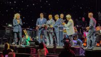 artemis 2 astronuats on a stage 