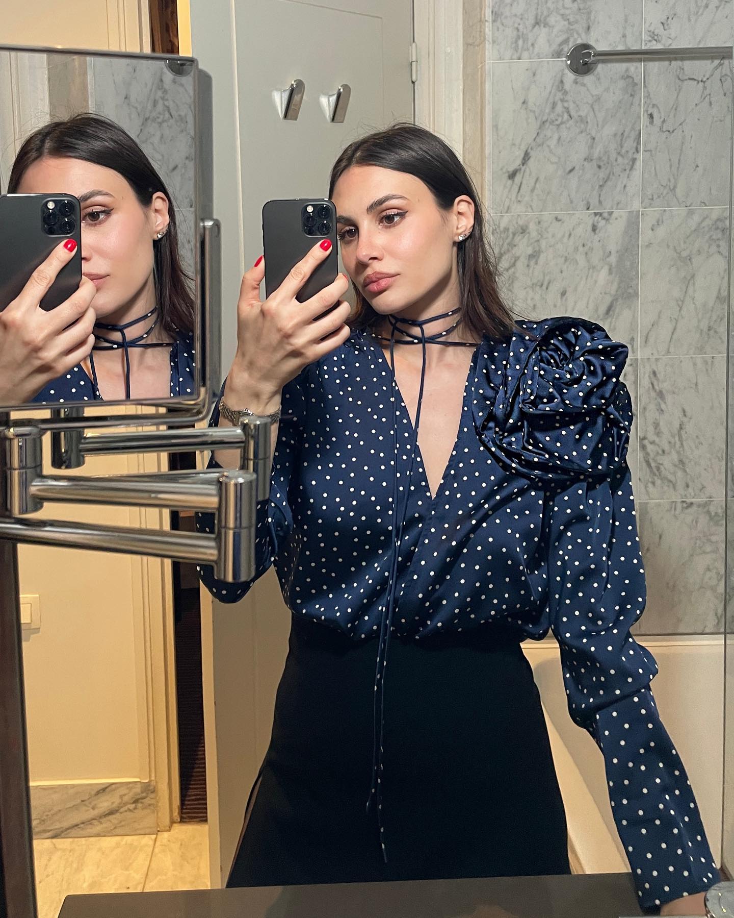 Influencer wears a blouse with elongated cuffs