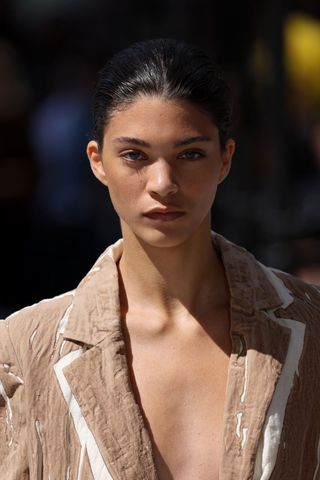 Model wearing powered skin, a key Spring/Summer 2025 fashion month beauty look, on the runway at Jason Wu Collection