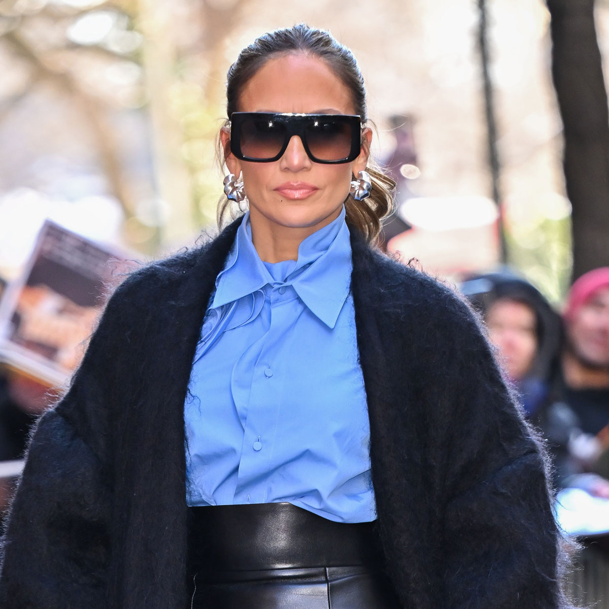 Jennifer Lopez wears baggy tracksuit pants for shopping tripbut ups the  glamour with wedge trainers
