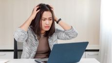 Woman annoyed at laptop crash