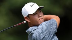 Tom Kim takes a tee shot at the Travelers Championship