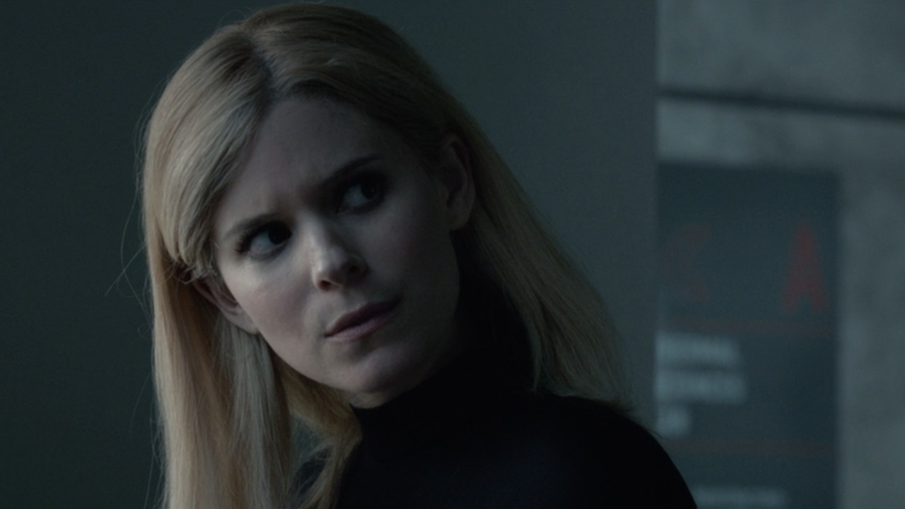 Sue Storm (Kate Mara) looks over at Reed Richards in Fantastic Four