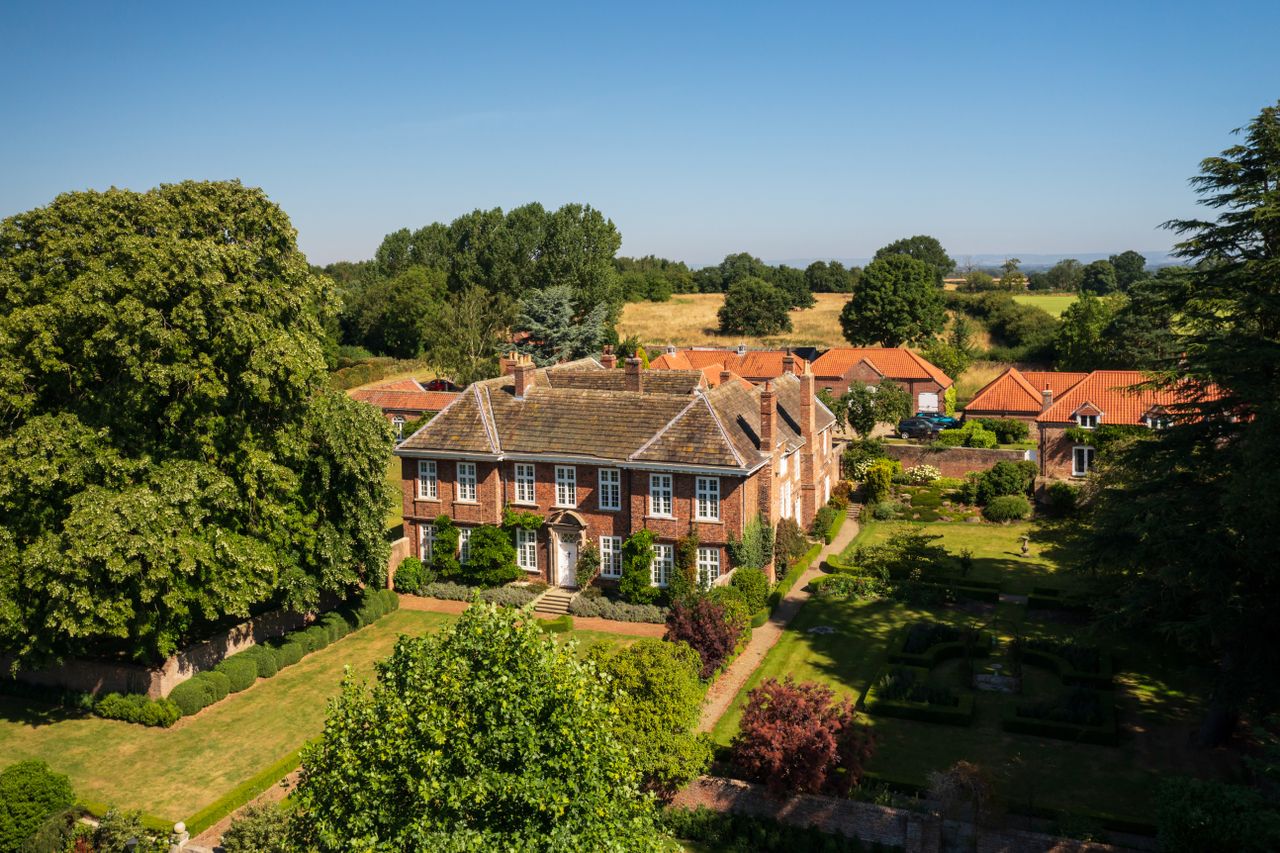 Big brick house with white windows in North of England