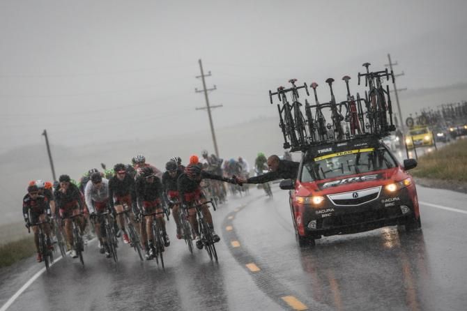 With the rain, team cars were kept busy passing off warm clothes to the riders