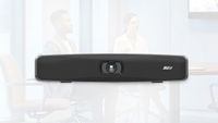 The new AVer VB150 videobar superimposed over a conference room.