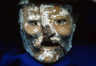 A close-up view of the head of Itzamna, which formed the base of an incense burner discovered at a Mayan council house in Petén, Guatamela.