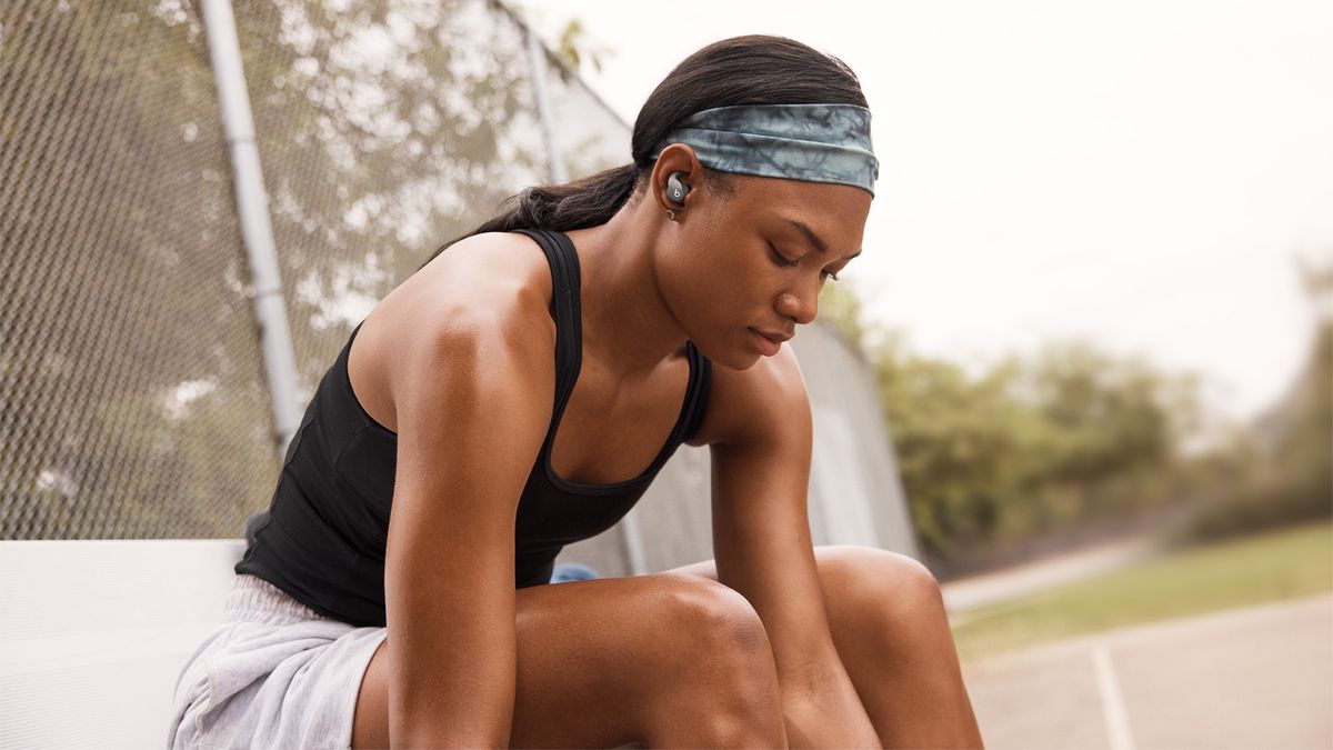 Woman wearing Beats Fit Pro headphones