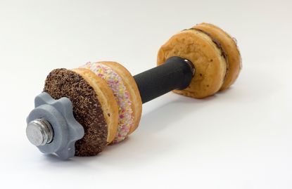 Donuts on an exercise barbell.