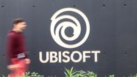 A man walks past the logo at main entrance of video production company Ubisoft where a 3-day strike is taking place in Montpellier, southern France on October 15, 2024. No more playing at Ubisoft: employees are mobilizing for a three-day strike, the second this year, as the French video game giant goes through a difficult time with slumping sales and the postponement of a major game, against a backdrop of rumors of a takeover of the company. (Photo by Pascal GUYOT / AFP) (Photo by PASCAL GUYOT/AFP via Getty Images) 